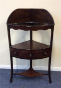 A mahogany corner commode with dummy drawers on st