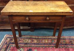 A mahogany hinged top games table with reeded supp