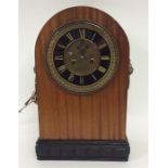 A French mantle clock with brass face and lion mas