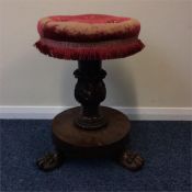 A Victorian rosewood piano stool on pedestal base.