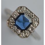 A stylish sapphire and diamond cluster ring in cla