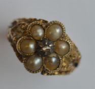 An Antique pearl and diamond cluster ring with lea