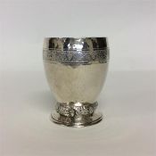 An unusual vine decorated goblet with hammered bod