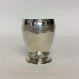 An unusual vine decorated goblet with hammered bod