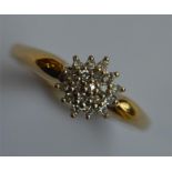 A 9 carat modern diamond cluster ring. Approx. 2.6
