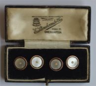 A pair of 9 carat and MOP cufflinks with pearl ins