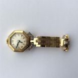 A lady's gold nurse's watch mounted with diamonds.