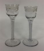 A pair of Georgian air twist glasses etched with f