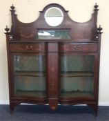 A good Edwardian inlaid serpentine fronted display