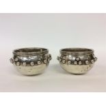 A pair of unusual Glastonbury bowls with ball deco