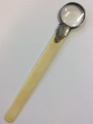 A silver mounted magnifier/paper knife with engrav