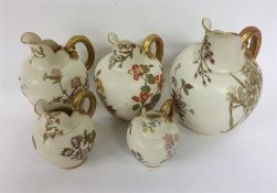 ROYAL WORCESTER: A good set of five ewers with gil