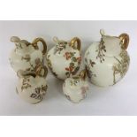 ROYAL WORCESTER: A good set of five ewers with gil