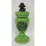 A green lustre oil lamp with lift-off reservoir an