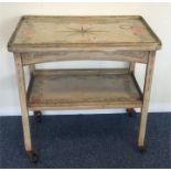 A Continental painted tea trolley attractively dec