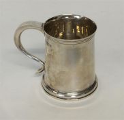 A small tapering christening cup with reeded body.