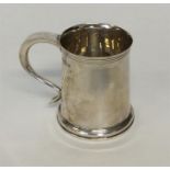 A small tapering christening cup with reeded body.