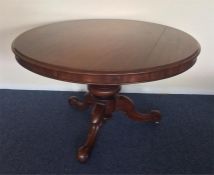 A mahogany single pedestal loo table with turned d