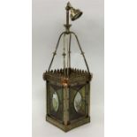 A large ornate lead glazed lampshade decorated wit