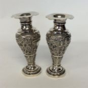 A pair of Indian tapered spill vases with wavy edg