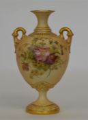 ROYAL WORCESTER: A baluster shaped vase decorated