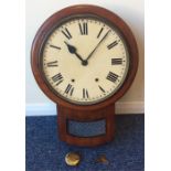 A mahogany wall clock with glass mounted inspectio