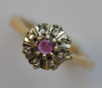An 18 carat ruby and diamond cluster ring. Approx.