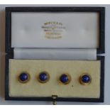 A cased set of four lapis studs of textured design