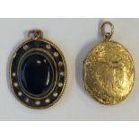 A high carat oval locket with hair centre together