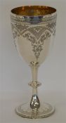A large engraved goblet decorated with flowers and