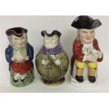 A group of three pottery Toby jugs. Est. £30 - £50