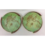 A pair of stylish plates with gilded decoration. E