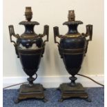 A pair of unusual brass mounted oil lamps on squar