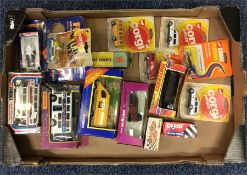 A box containing Corgi school buses, AA van etc. E