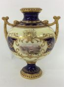 COALPORT: A baluster shaped vase decorated with fl