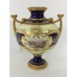 COALPORT: A baluster shaped vase decorated with fl