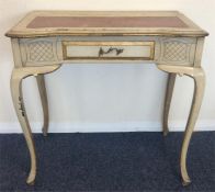 A Continental serpentine fronted desk with leather