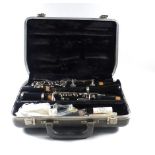 A cased clarinet by Boosey & Hawkes of London together with an American 'Aristocoral' clarinet by