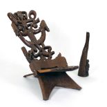 A 20th century Malawi carved hardwood birthing chair together with an African carved rosewood