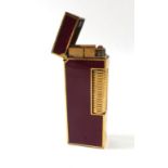 A Swiss lighter in a leather case by Dunhill