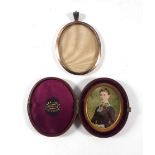 A 19th century miniature overpainted head and shoulders portrait in a fitted leather case, 6.