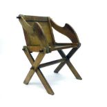 A late 19th/early 20th century oak 'Glastonbury' chair of typical construction