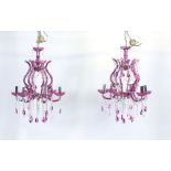 A pair of Murano-type pink glass and paste six branch chandeliers with droplets together with a