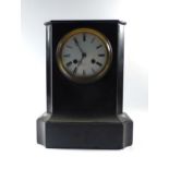 A Victorian mantle clock striking on a bell,