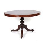 A 19th century mahogany circular breakfast table on a turned column and three splayed feet, w. 117.