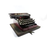 A vintage cased Bar-Let typewriter in red