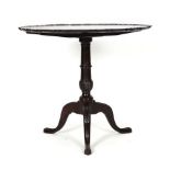 An 18th century and later mahogany tilt-top table,