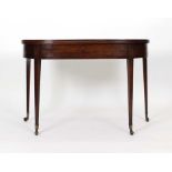 An early 19th century mahogany and walnut crossbanded tea table,