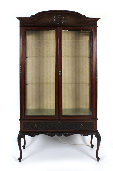 An early 20th century mahogany and glazed two door display cabinet on cabriole feet, w.