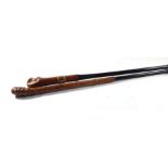 Two Colonial ebonised walking canes